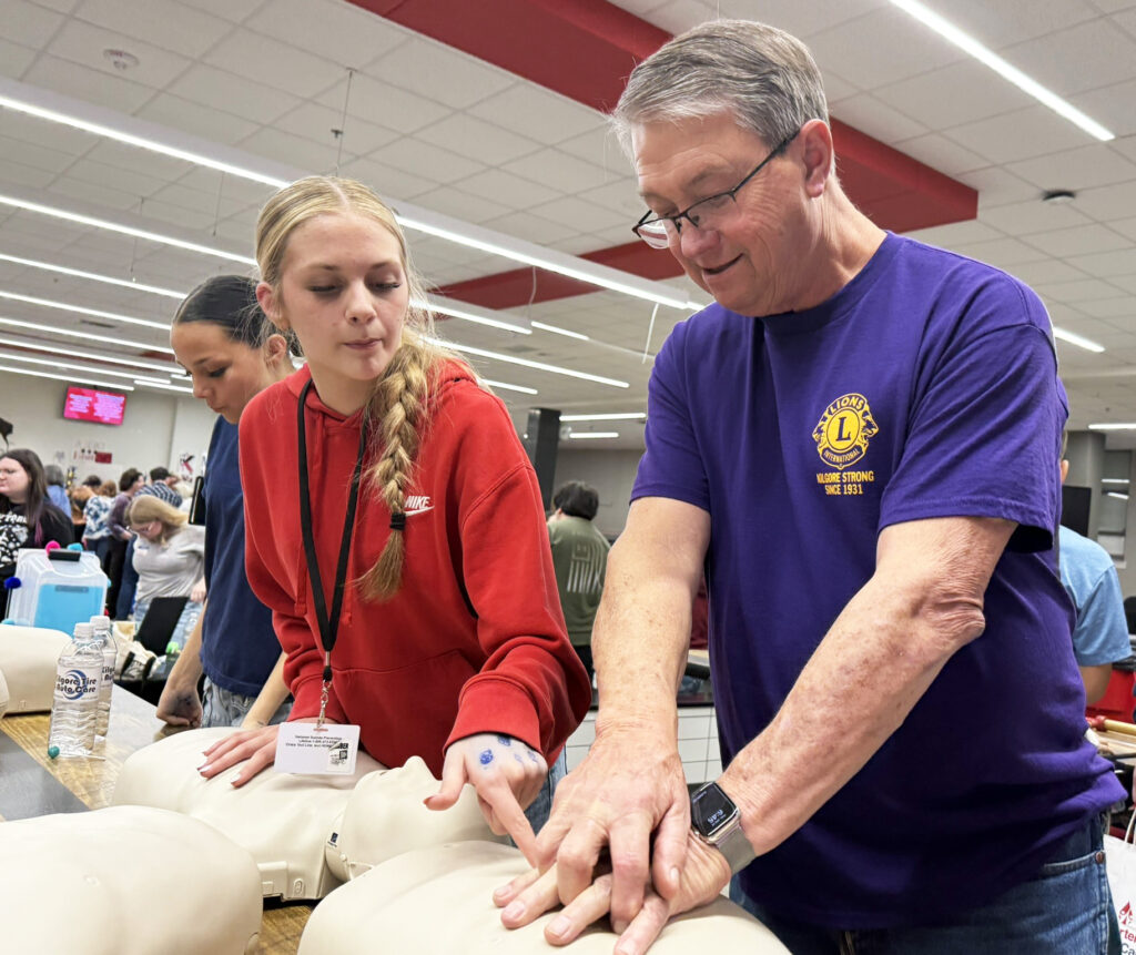 students practicing CPR on dummies